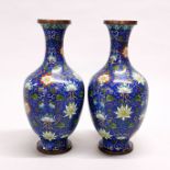 A pair of mid 20th century Chinese cloisonne vases, both in good condition without dents, H. 23cm.