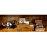 A silver plated tea pot and a quantity of wooden boxes.