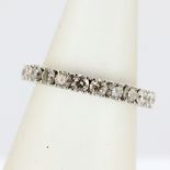 A 14ct white gold diamond set full eternity ring, overall 2ct, (N).