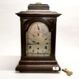 A 19th century chiming bracket clock with silvered dial, H. 46cm.