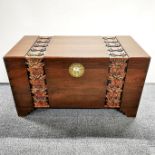 An oriental carved camphorwood chest with brass fittings, 100 x 55 x 50cm.