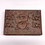 A 19th century Chinese carved wooden box, decorated with a dragon and birds carrying spring blossom,