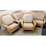 A good quality upholstered cane four piece conservatory suite, settee W. 136cm.