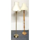 A brass standard lamp and a turned wooden lamp.