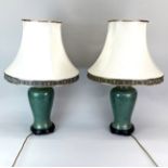 A pair of porcelain table lamps and silk shades, H. 69cm.