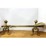 A set of Victorian brass fire dogs and tools, tool L. 72cm.