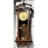 A 19th century oak Waterbury striking wall clock, 39 x 100cm.