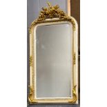 A large painted and gilt overmantel mirror, W. 85cm, H. 161cm.