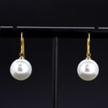 A pair of 9ct yellow gold (stamped 375) cultured pearl set drop earrings, L. 2.5cm.