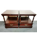 A pair of single drawer stained hardwood side tables on castors, 56 x 49 x 49cm.