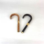 Two snakeskin covered umbrella / cane handles, L. 19cm.