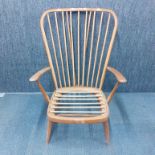 A 1960's golden Ercol armchair, H. 103cm. With treated woodworm.