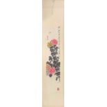 A scroll mounted Chinese ink and watercolour on paper depicting chrysanthemums and dragonfly,