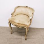 A French dressing table chair with floral upholstery and carved decoration, H. 63cm