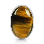 A 925 silver adjustable ring set with cabochon cut tiger's eye.