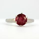 A 9ct white gold solitaire ring set with a ruby (M).