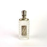 An early 20th century continental cut glass and white metal perfume bottle with continental part