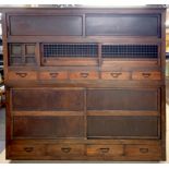 A large stained pine vintage kitchen cabinet in two sections, W. 178cm, H. 178cm, D. 44cm.