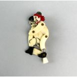 A carved bone working cartoon model of Hitler being assaulted (known as 'Rogering Hitler') H. 6.