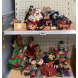 A collection of vintage travel souvenir dolls.