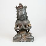 An interesting cast iron figure of a Buddhist monk in prayer, H. 21.5cm.
