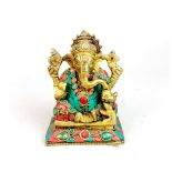 A gilt bronze figure of seated Ganesh inlaid with stones, H. 13cm.