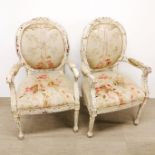 A pair of French carved and painted, upholstered salon chairs, H. 105cm.