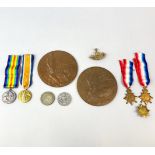 Two WWI bronze death plaques for William and Charles Green, together with medals for 4294 Private
