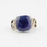 A 925 silver ring set with a large cushion cut blue sapphire and white topaz, sapphire size 1.2 x