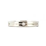 A 9ct white gold wedding band set with diamonds, (L.5).