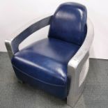 A contemporary aviation style armchair with sheet aluminium and faux leather upholstery, 85 x 75 x