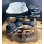 Two kitchen scales and weights.