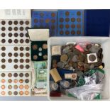 A large box of mixed coins and bank notes.