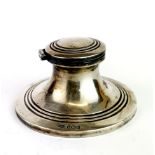 A hallmarked silver inkwell, Dia. 8cm.