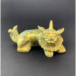 A small Chinese gilt bronze figure of a mythical animal, L. 13cm, H. 6cm.