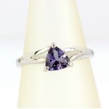 A 9ct white gold ring set with a trillion cut tanzanite, (N).