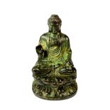 A small bronze figure of a seated Buddha, H. 9.5cm.