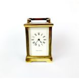 A Mappin and Webb gilt brass carriage clock, not currently in working order with attention