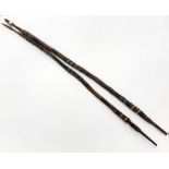 Two tribal spears, with leather bound shafts, L. 163cm.