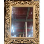 A large gilt framed bevelled edge mirror, frame size 101 x 121cm.