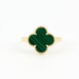 An 18ct yellow gold (stamped 18K) malachite set clover ring, (M.5).