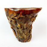 A Chinese carved horn libation cup, H. 15cm.