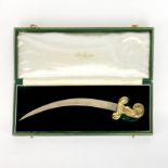 A boxed De Lamerie hallmarked silver (London c. 1988) and gilt sword letter opener.