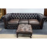A Thomas Lloyd button backed three seater chesterfield settee and matching footstool, 195 x 90 x