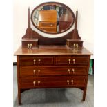 An inlaid mahogany six drawer, mirror backed dressing table, 150 x 106 x 80cm.