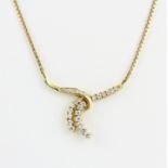 An 18ct yellow gold necklace set with graduated diamonds, L. 48cm.