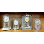 Four torsion pendulum clocks, tallest H. 31cm.