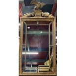 A gilt framed mirror mounted with an eagle, W. 73cm, H. 130cm.