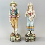 A pair of Austrian glazed pottery figures of musicians c.1900, H. 40cm. Girl A/F to top of lute.