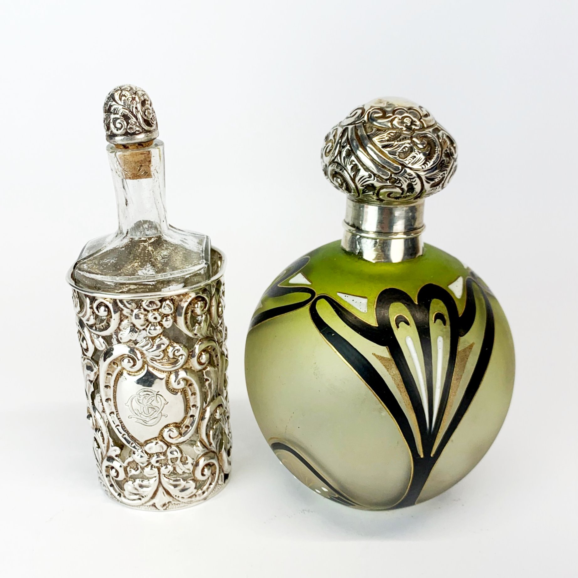 A hallmarked silver cased cologne bottle (Chester c.1908) H. 14cm together with a white metal topped